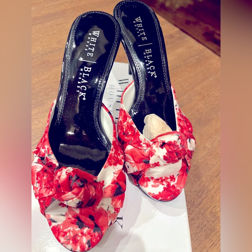 Beautiful pink and white floral. Never worn. Black heel. Cute tie knot.